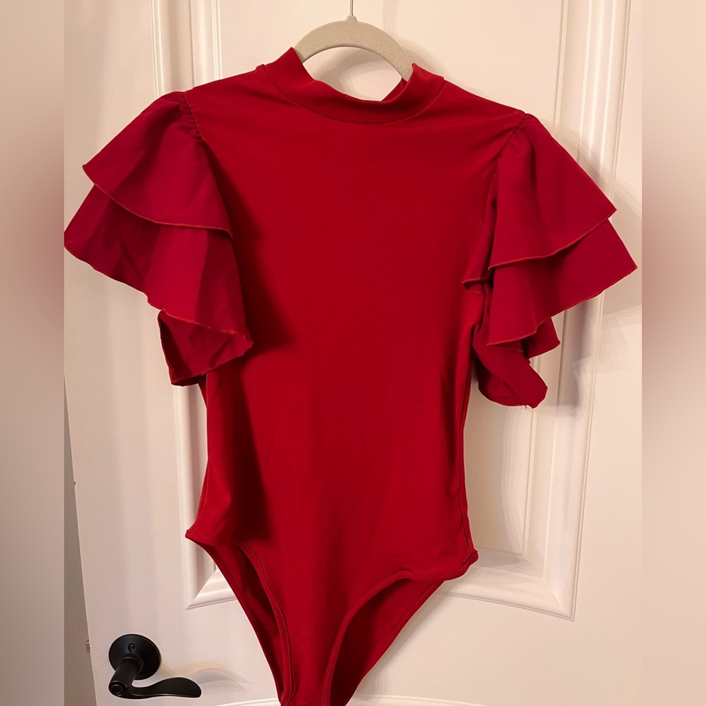 Soly Hux red bodysuit. Arms with ruffles. Really cute with jeans or skirt/pants.